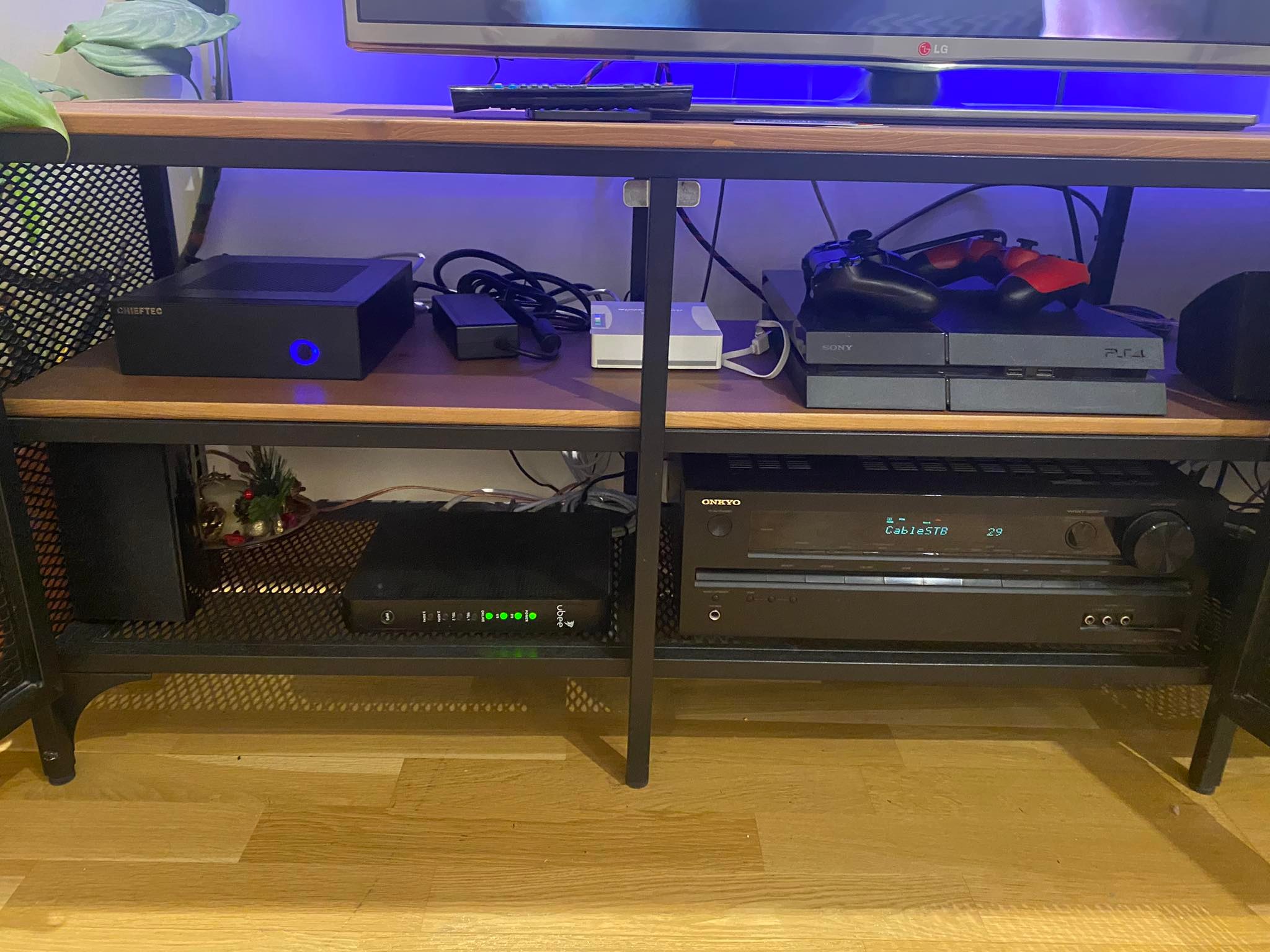 Assembled HTPC displayed with other devices for scale